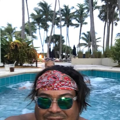 Oliver Maldonado Author Photographed at Ritz Carlton looking like a Hippie