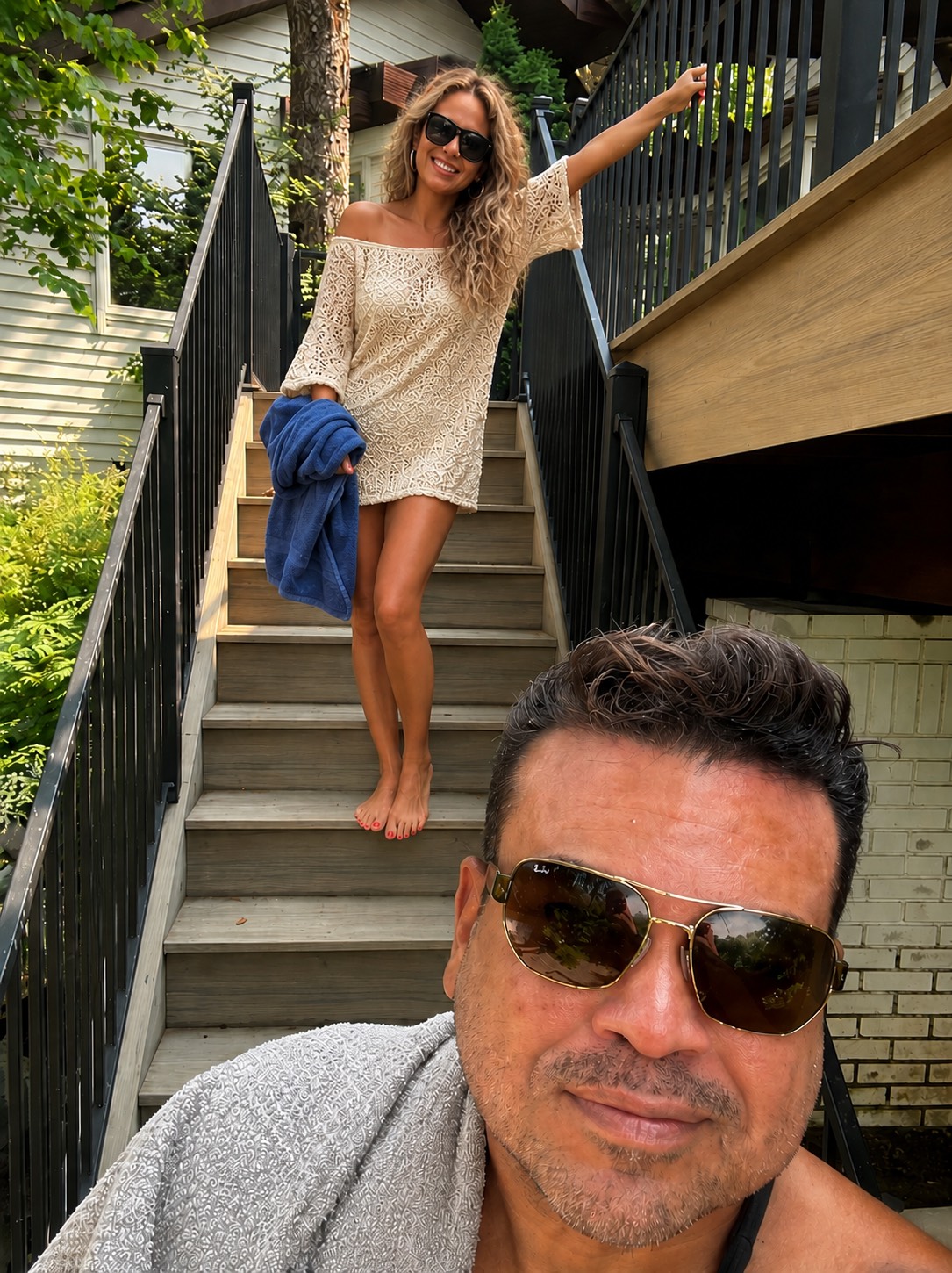 Oliver Maldonado Author pictured with his wife in front of house & on computer