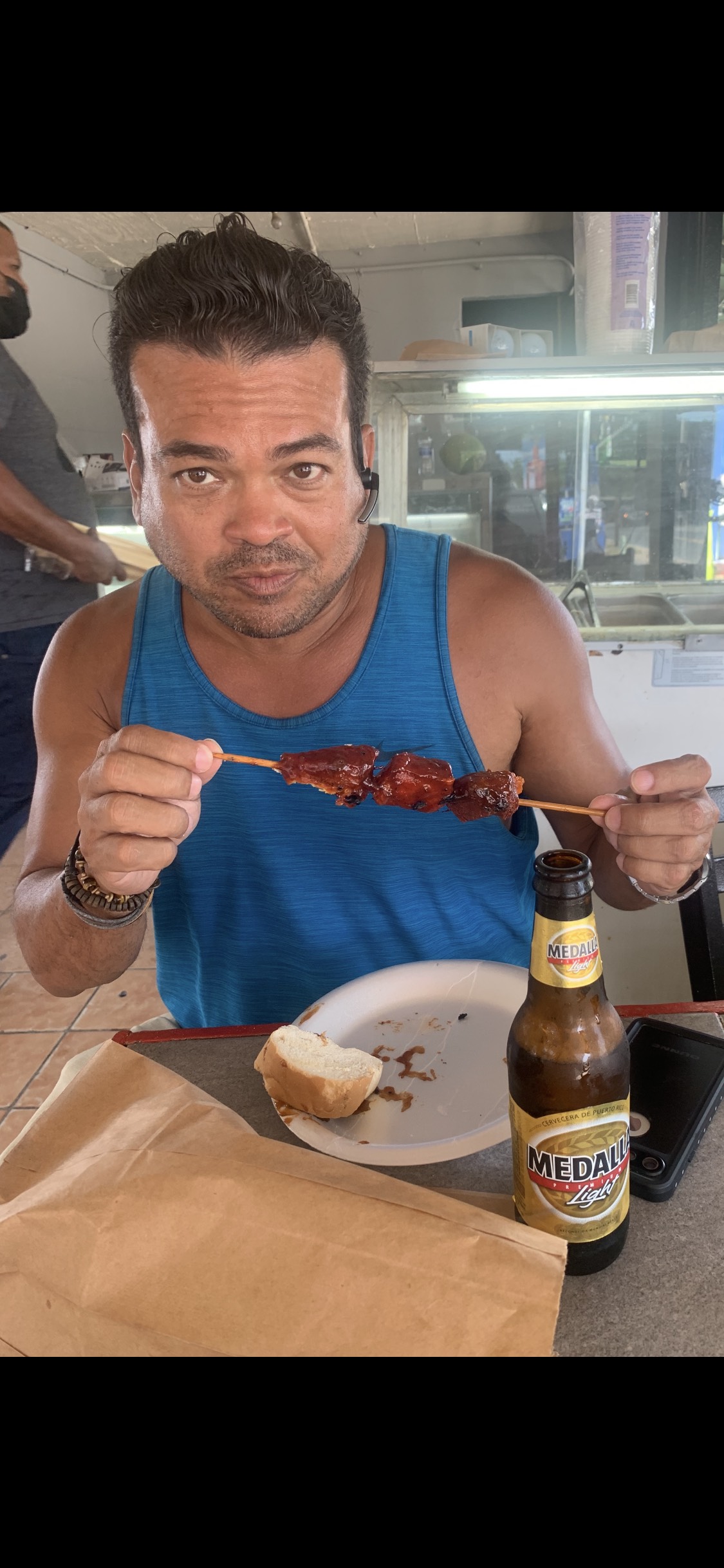 Oliver Maldonado Author Photographed eating Pinchos in Piñones Puerto Rico