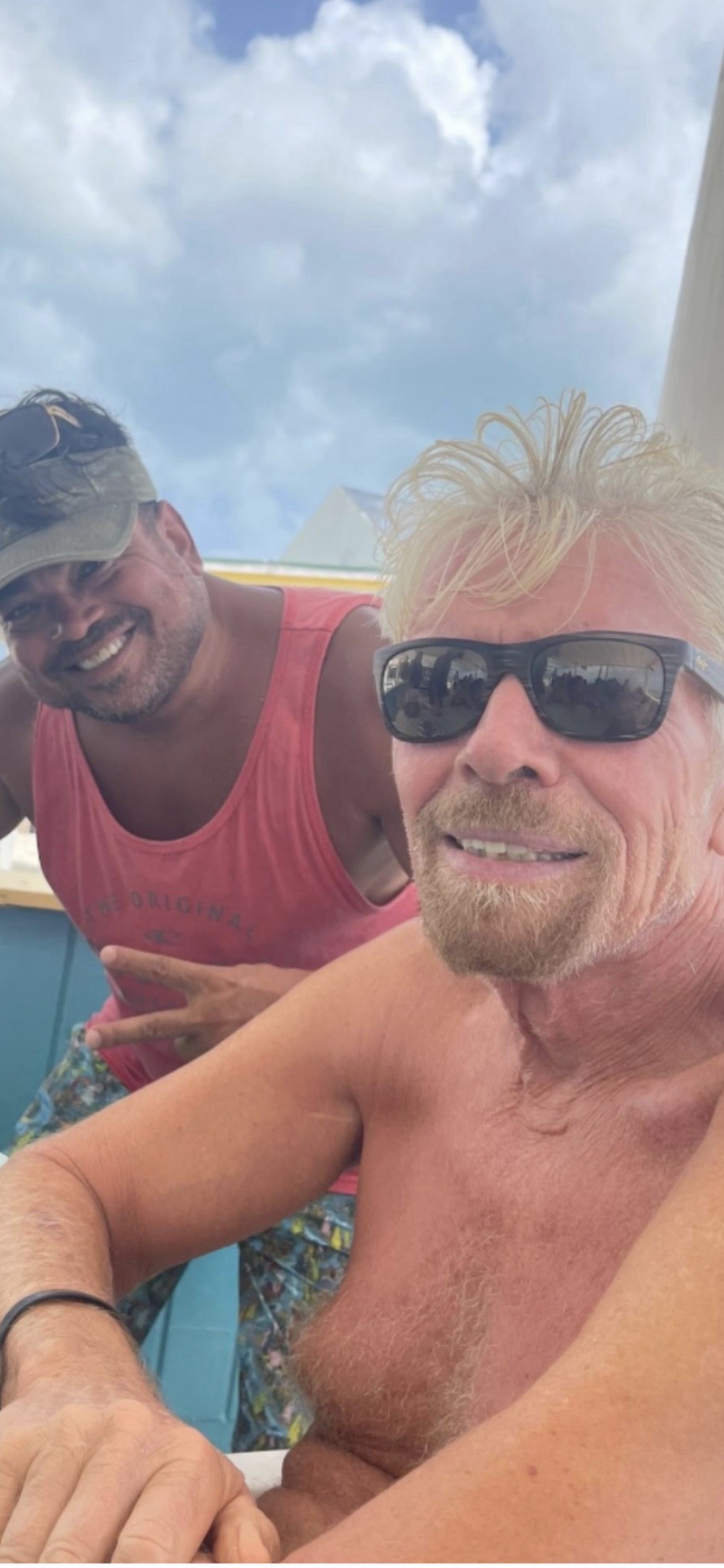Oliver Maldonado photographed with Sir Richard Branson on the Beach in Virgin Islands